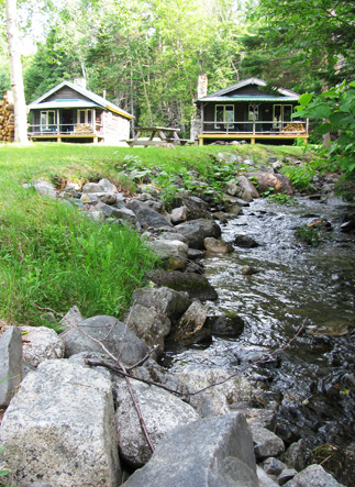 Snowmobile trail outside cabin door